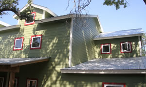 photo of metal roof of large, green house